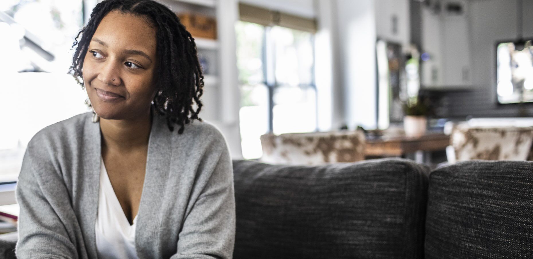 A man looks out over a lake